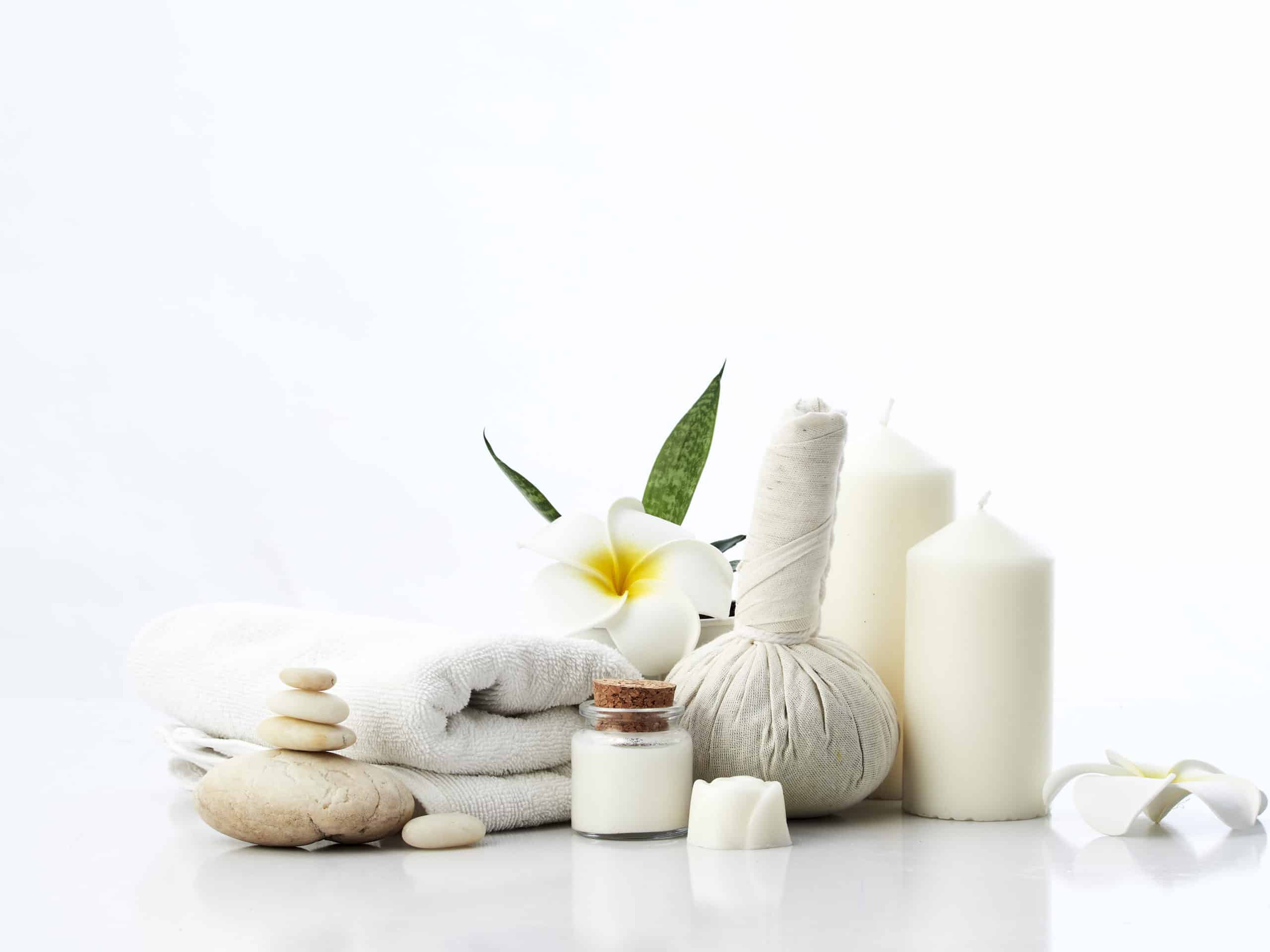 Spa Massage Concept, Herbal Compress Ball, Cream, Flower Soap, Scented Candle on White Background